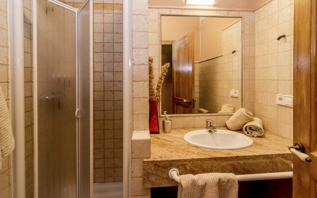 Two shower rooms are en suite